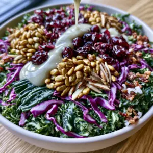 Top-down macro shot of sunflower crunch salad featuring emerald kale and purple cabbage ribbons.