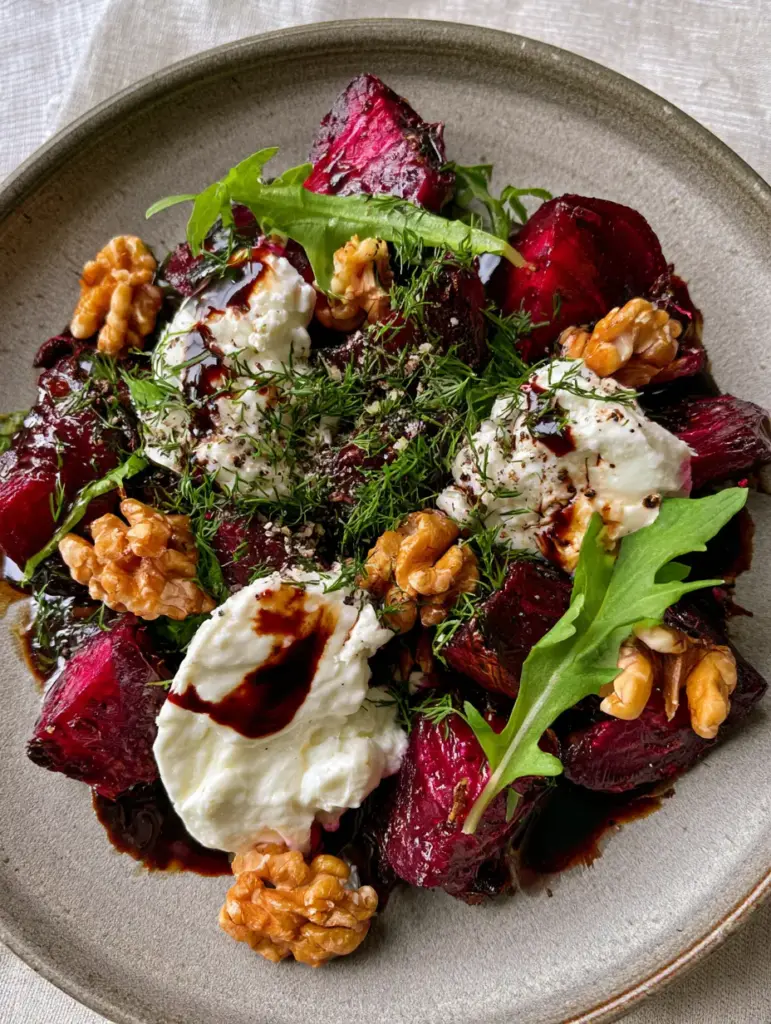 Beetroot Salad with Roasted Balsamic Glaze and Feta 1 Slightly angled photo of Beetroot Salad highlighting the glossy dark mahogany balsamic reduction and fresh green dill.